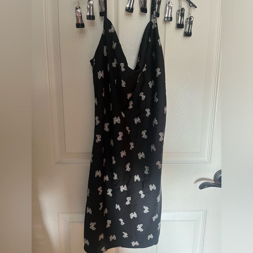 Women’s black dress with butterflies